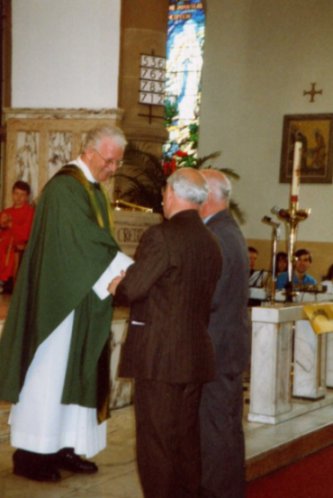 Fr Andrew saying Mass on a dry day